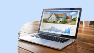 Collection of laptop screens showing different real estate websites, with Afghan properties visible